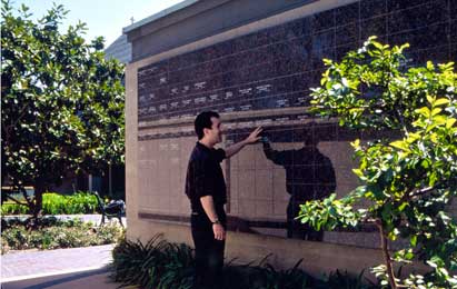 Man Viewing Engraved Wall at St. Dunstan Picture 1